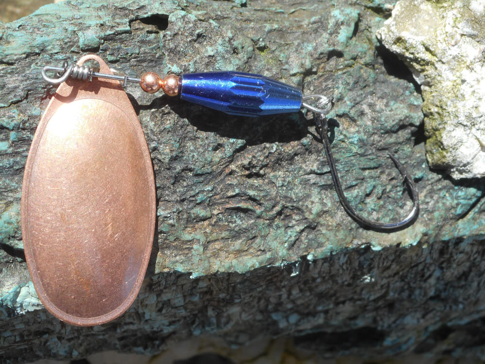 Copper bladed steelhead spinner with a blue weighted body