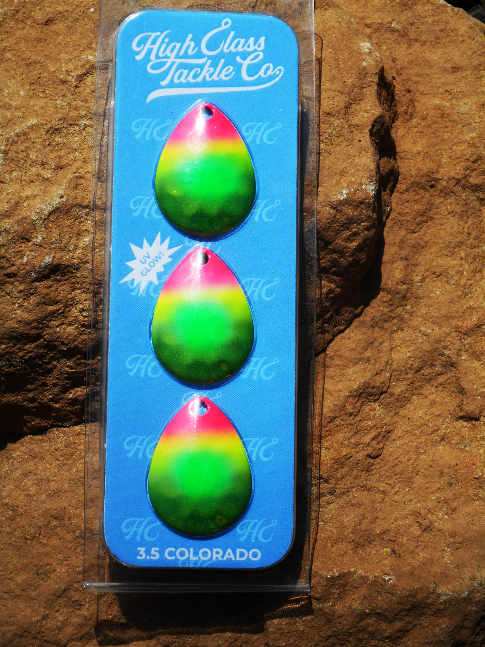 A chaertreuse, pink, and green rainbow steelhead and salmon spinner blade