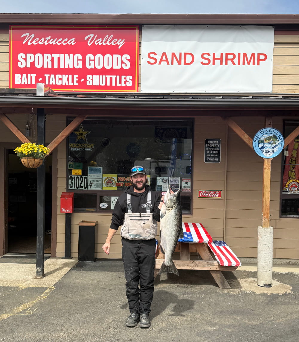Hebo Sporting Goods fisherman with a bright fall chinook