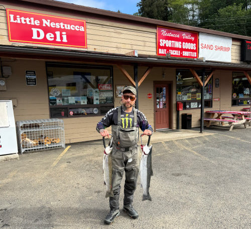 Heho Sports Shop happy fisherman with a pair of Summer Steelhead