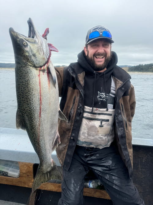 fisherman with beautiful Nestucca Bay fall chinook
