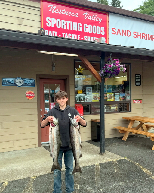 Customer with his fish in front of our store