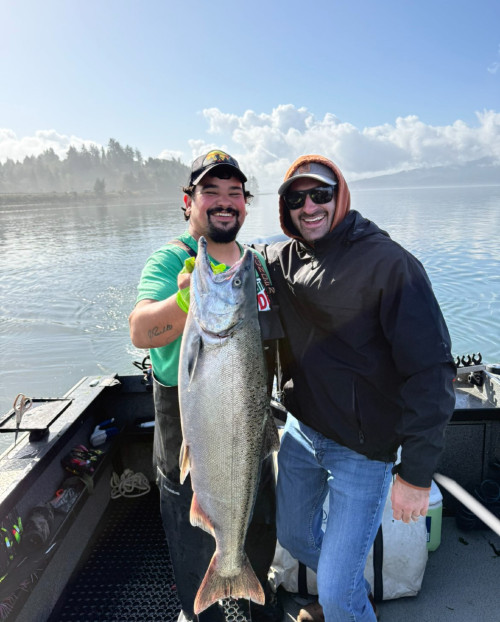 Hebo Tackle Shop guide with his cxlient and a Chinook Salmon