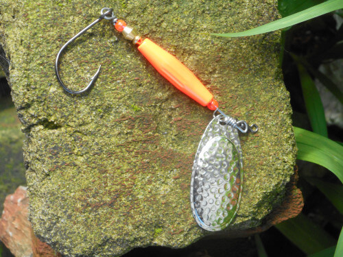 Weighted red-bodied, silver-bladed salmon or steelhead spinner